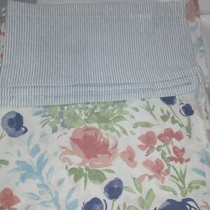 2 - Shower Curtains.       1- Floral and 1 Gray Striped.